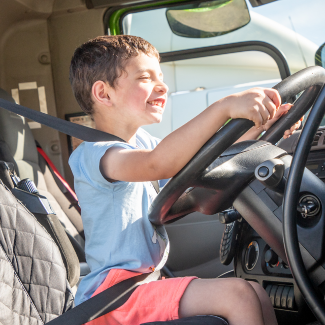 Boy sitting in HGV cab at PFS Training